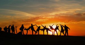 People Celebrating quitting vaping by a sunset