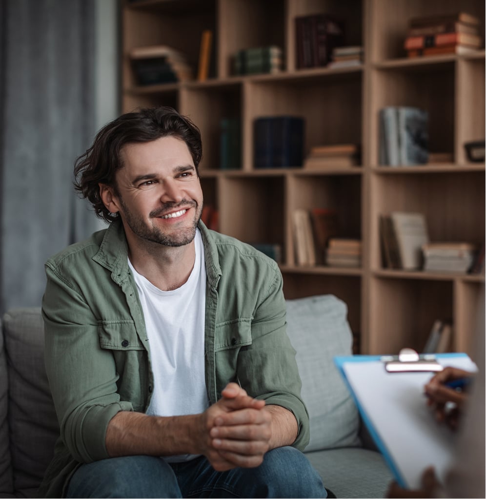 Hero-image2 - Portage Path Behavioral Health A man smiling during a supportive mental health treatment session.